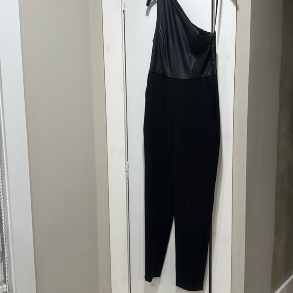 BCBGenerarion 
Jumpsuit.   Faux leather top.   Size 0